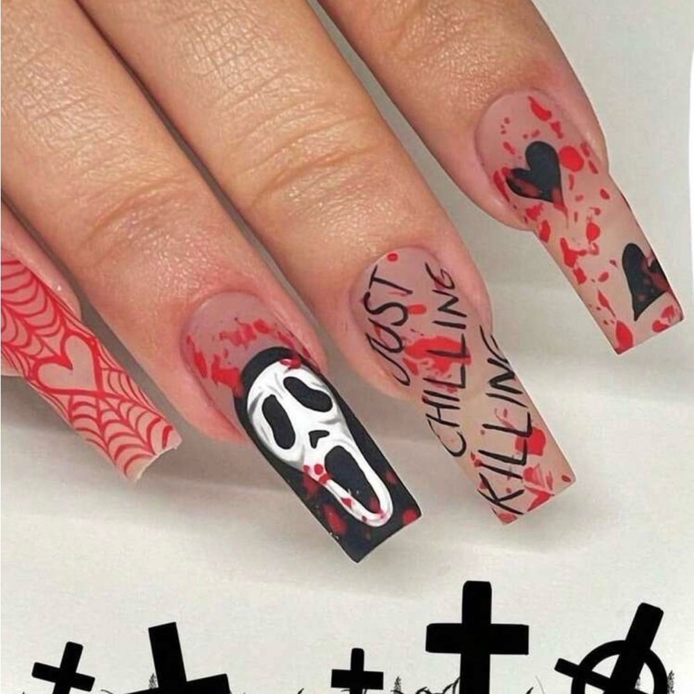 Halloween Themed Nail Art with Red and Black Design